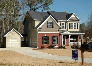 Beautiful two-story suburban home with a brick and siding exterior, a front porch, and a 'For Sale' sign in the yard. Perfect for homebuyers in Maryland, Washington, D.C., and Pennsylvania